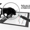 Momentum seen as a bull on a stock chart through a magnifying glass!